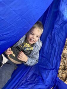 boy in a tent with crackers