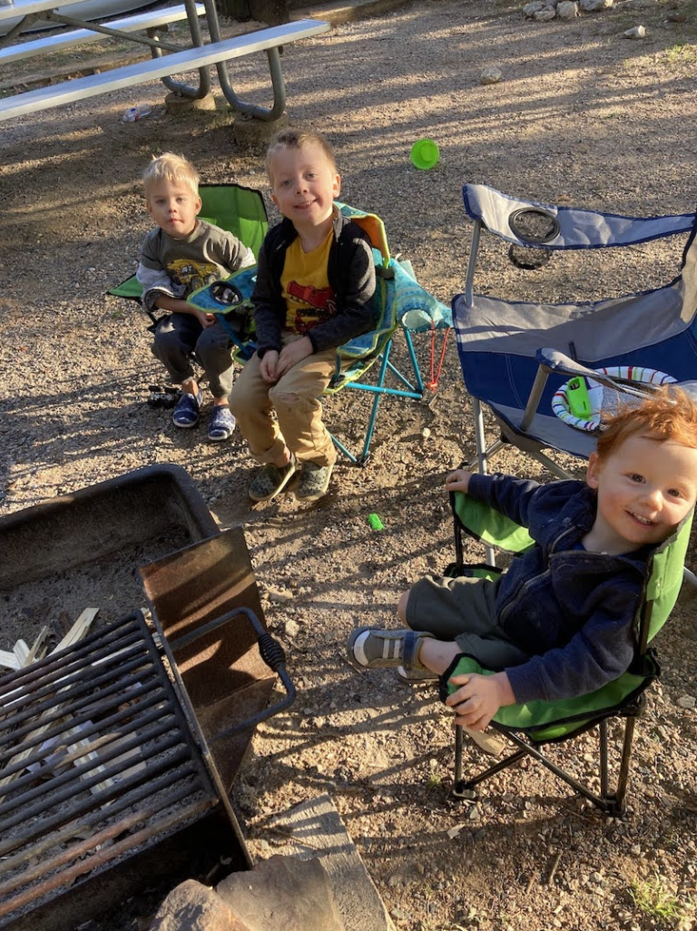 3 boys in camp chairs