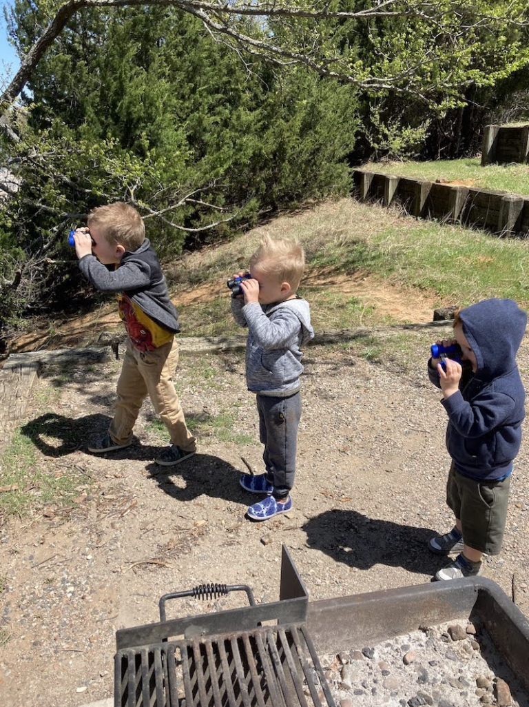 boys looking through binoculars
