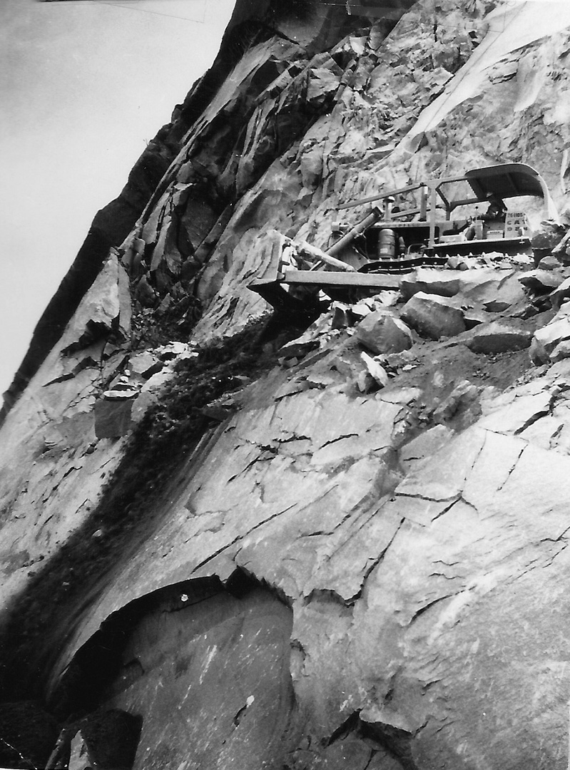 bulldozer on the side of a high mountain