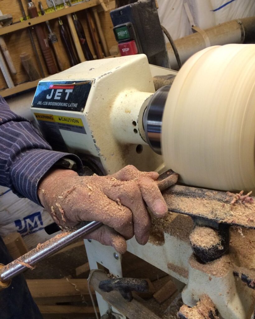 Turning wood bowl on a lathe