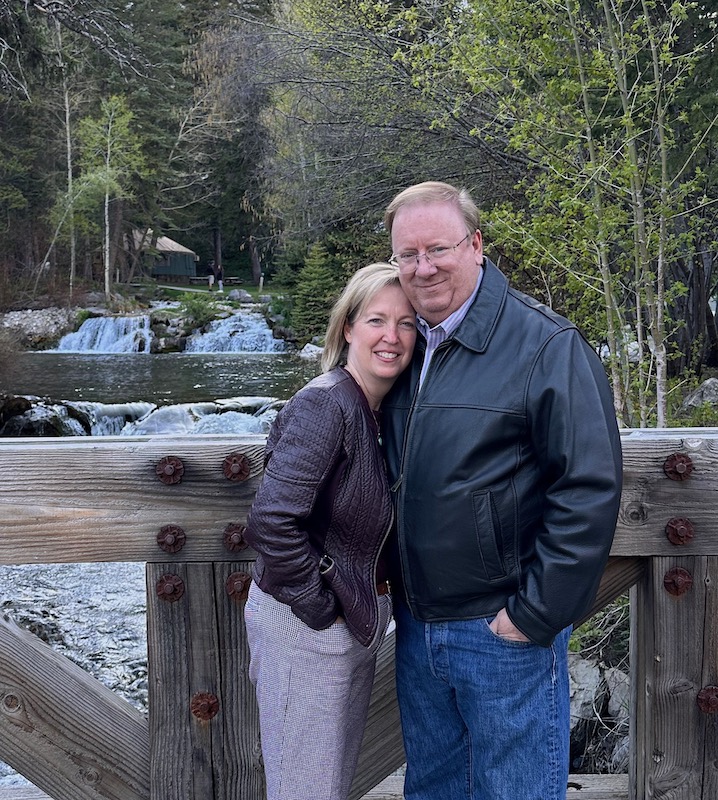 A couple by a mountain stream