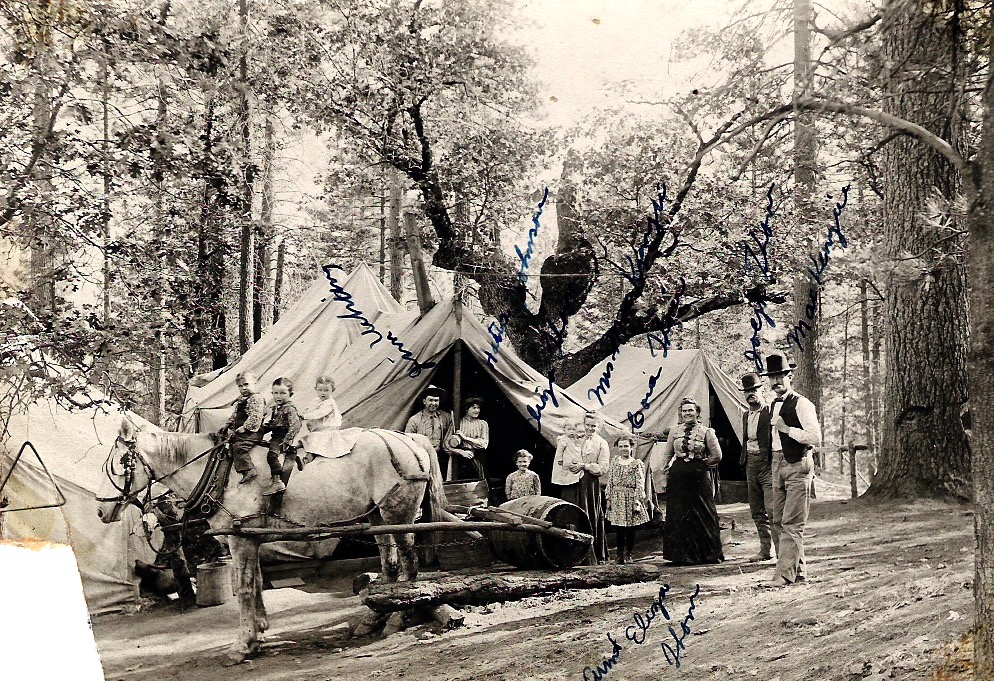 Jim and Hattie, standing in the door of the tent. This may have been a construction camp.