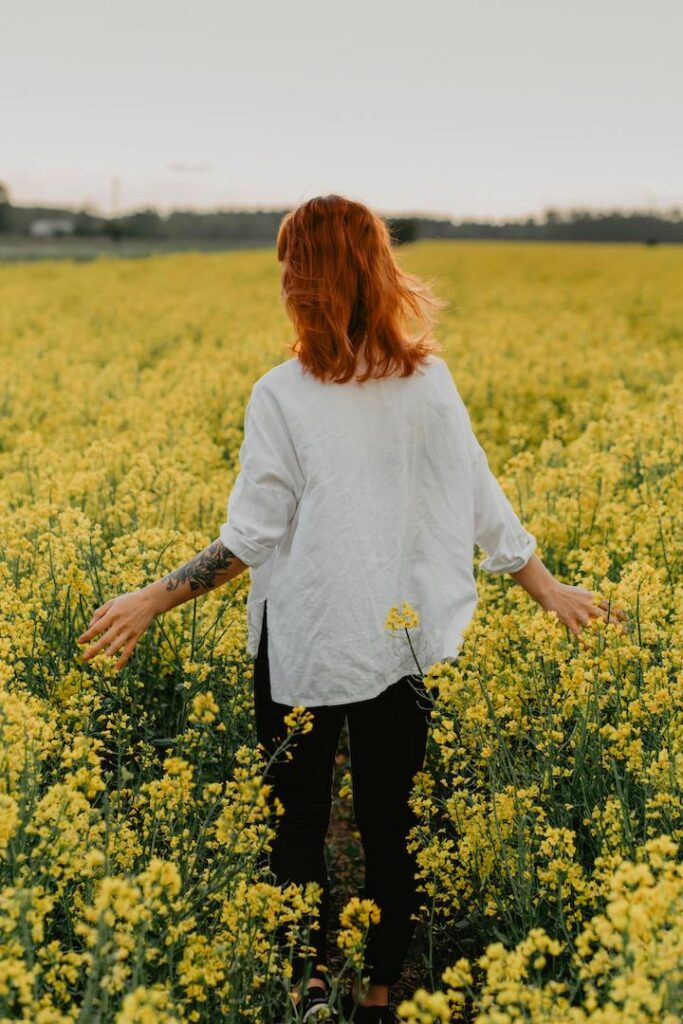 Woman in field of flowers