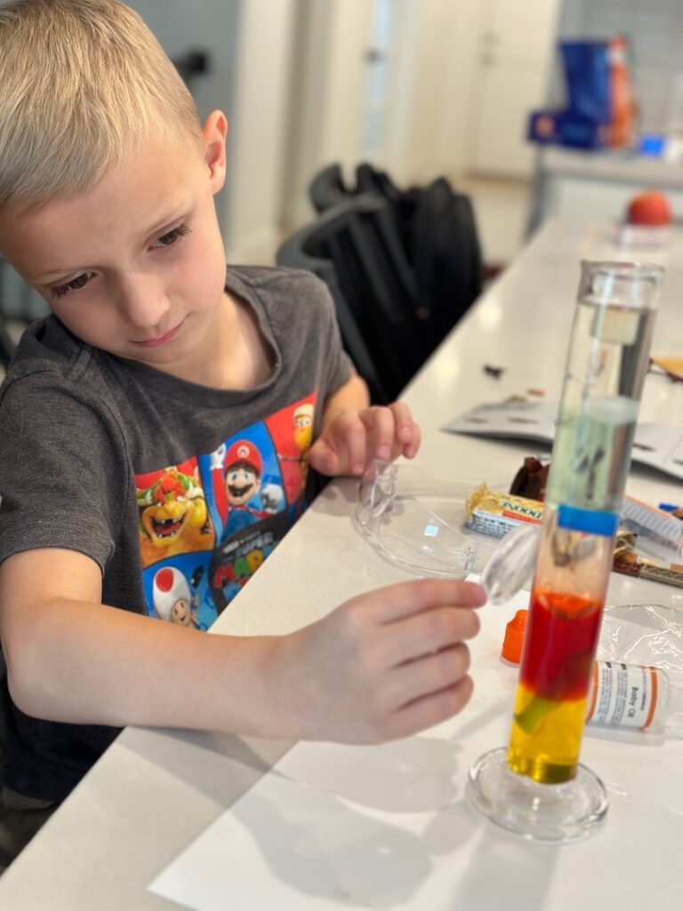 boy doing science experiment