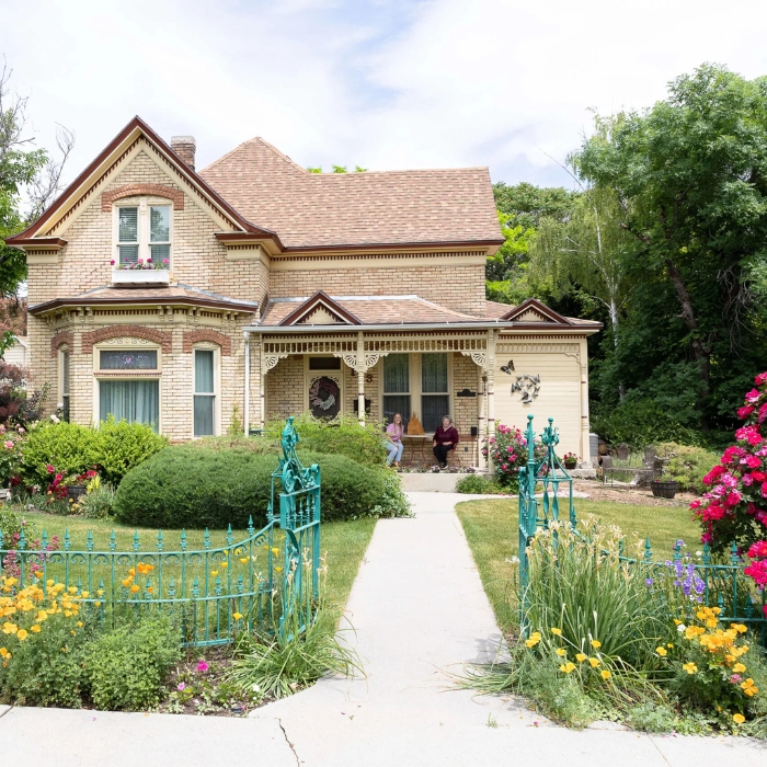 Heritage home with people on the porch